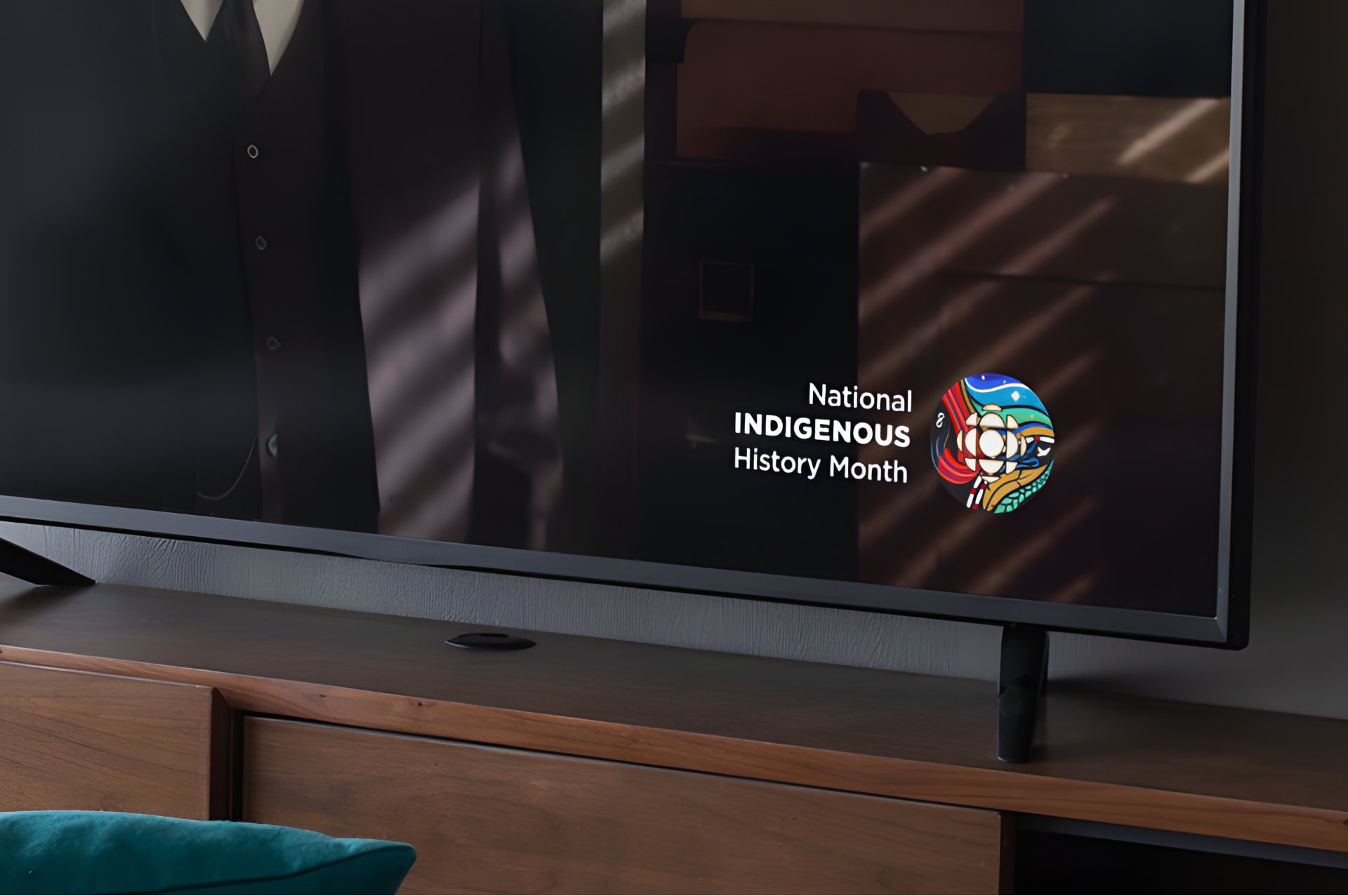 A TV screen displays the words 'National Indigenous History Month' alongside the logo DDP created for CBC