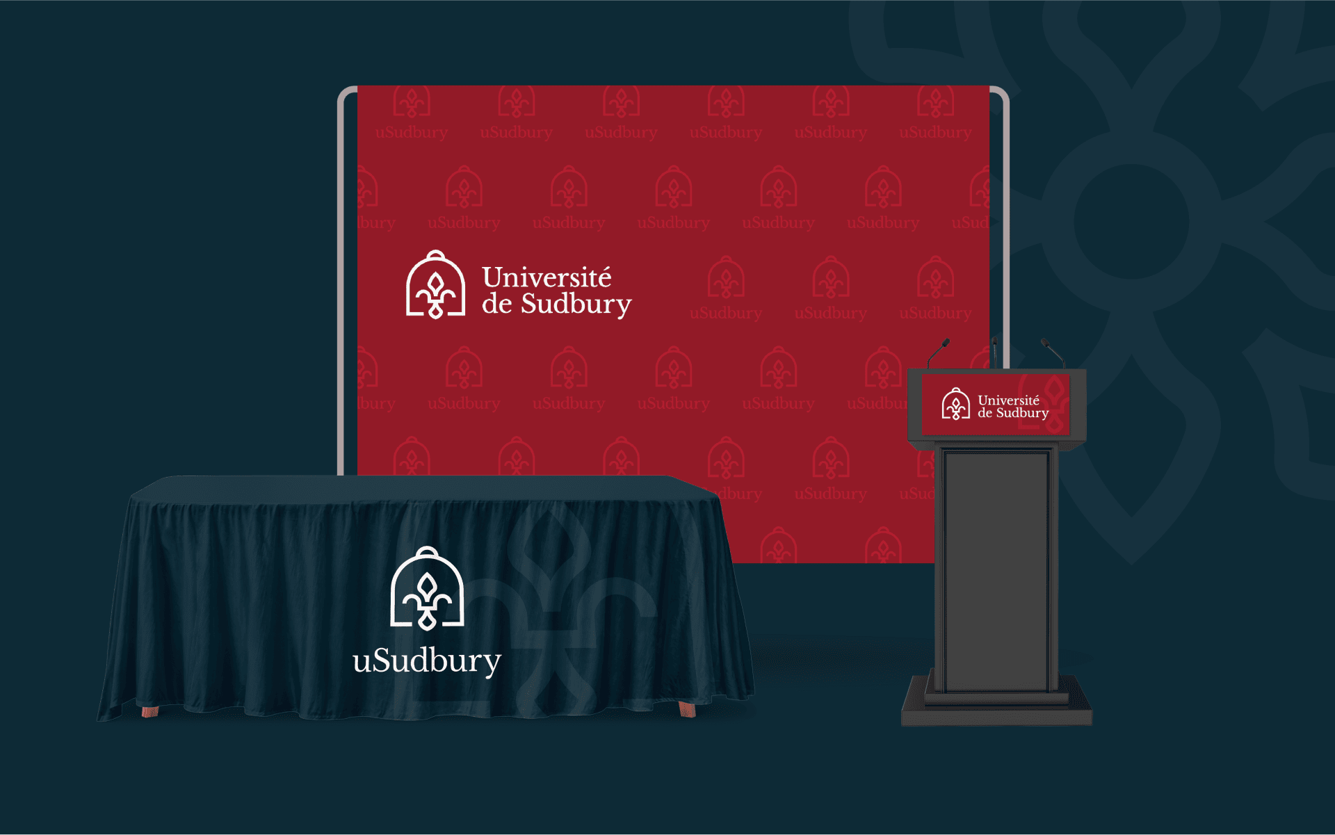 Mockup of promotional material featuring the Université de Sudbury brand, including a large red banner, a podium stand, and a nav table cloth.